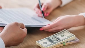 cropped-view-of-woman-signing-loan-agreement-on-cl-ZVXTZSE-scaled-1-2048x1152.jpg-1